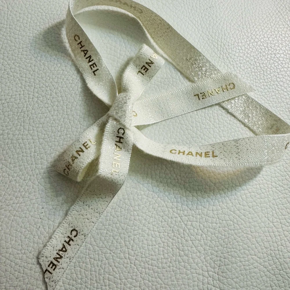 Chanel White Ribbon w gold font limited edition for holiday